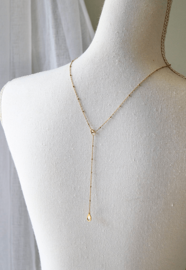 Collier de dos - Coquillage